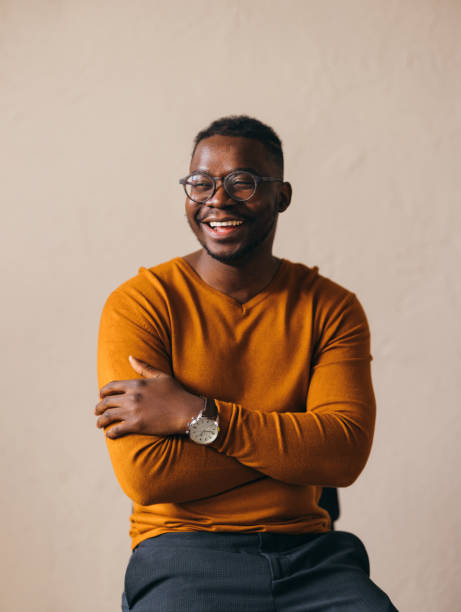 Happy African American male posing with confidence and joy.